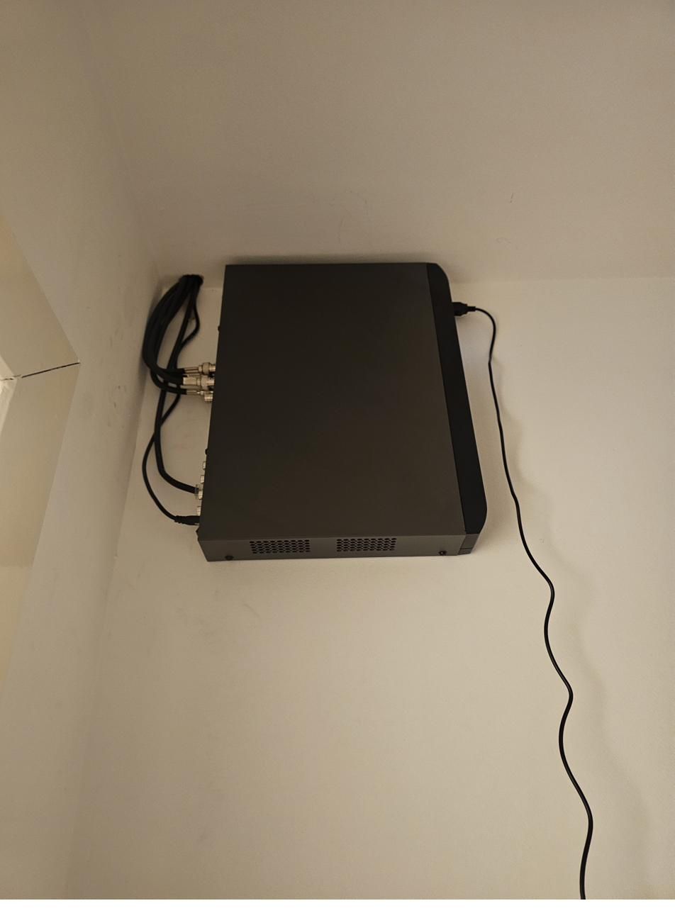 Compact recorder neatly wall-mounted in a cupboard