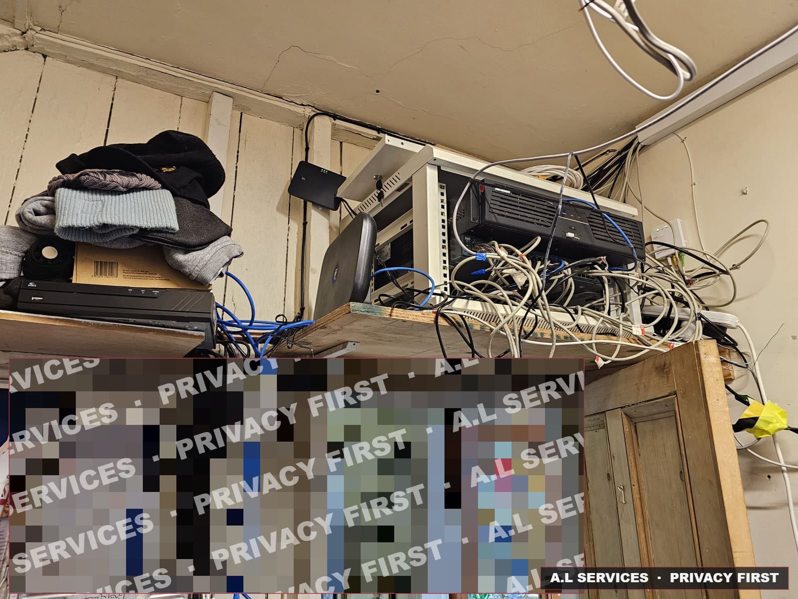 Before: tangled network cables and recorders piled on a makeshift shelf above a shop doorway