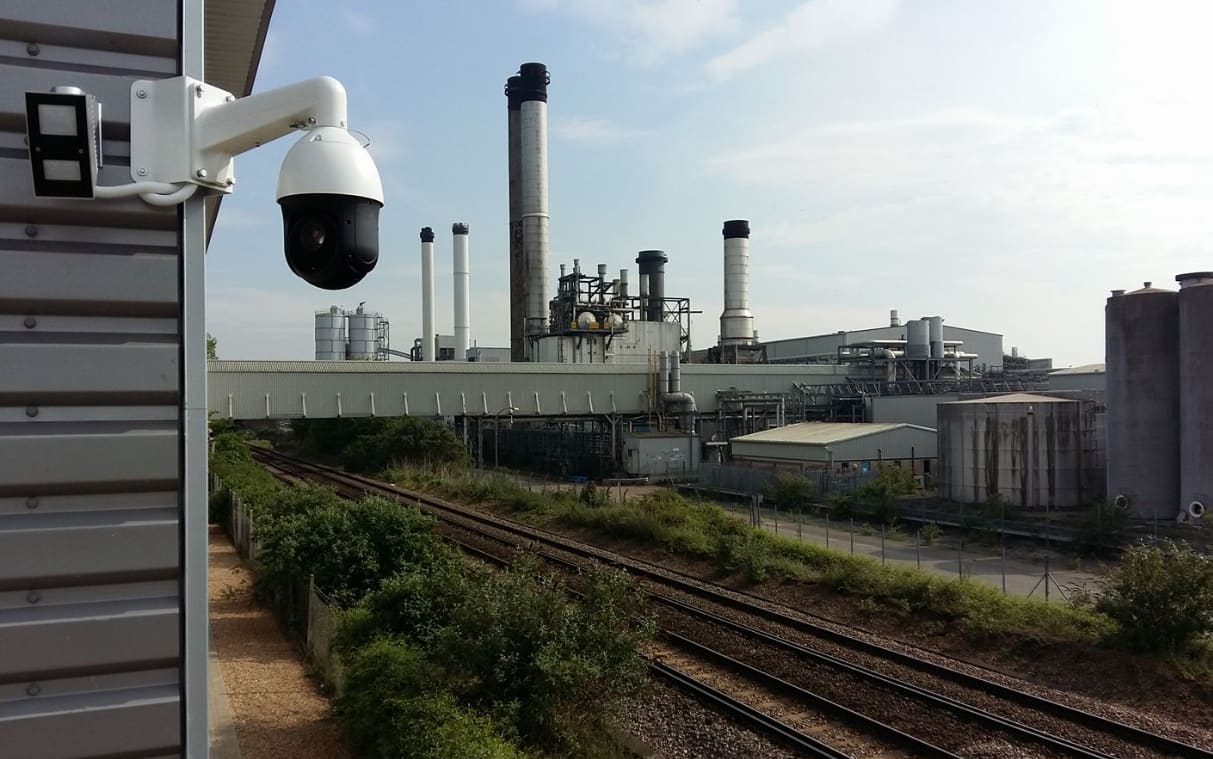 PTZ camera overlooking railway lines and an industrial plant